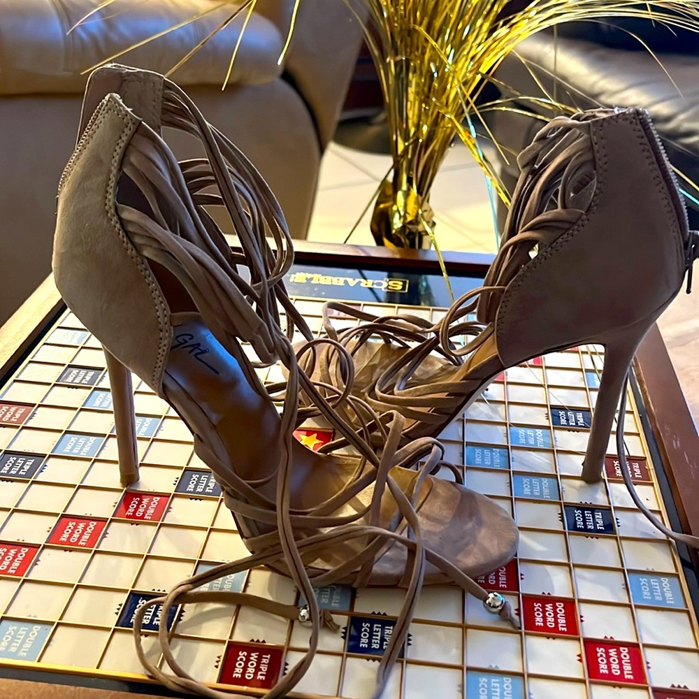 Straps lace up sandal heels.  Beautiful sexy shoes